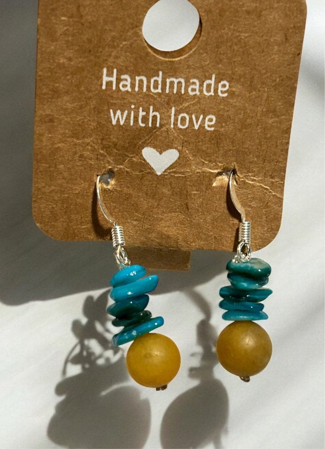 Earrings made using stone beads and yellow jade